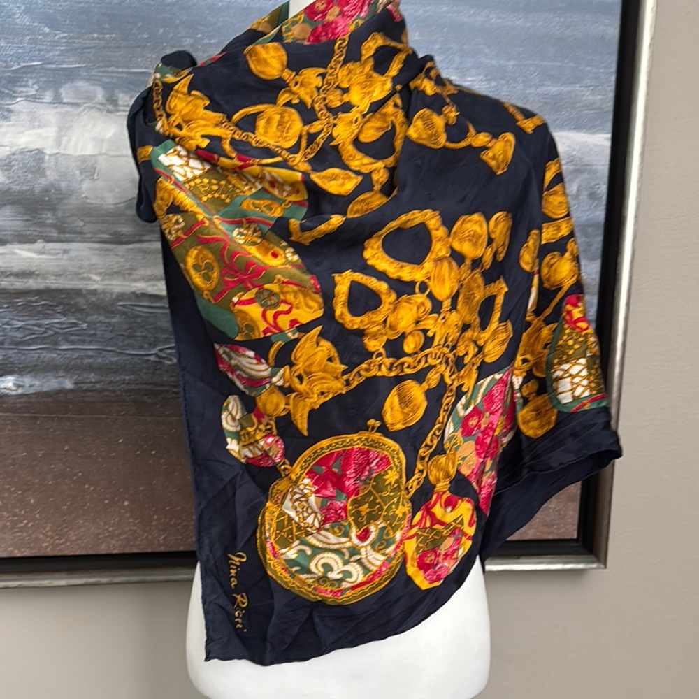 Elegant Black and Gold Scarf by Nina Ricci